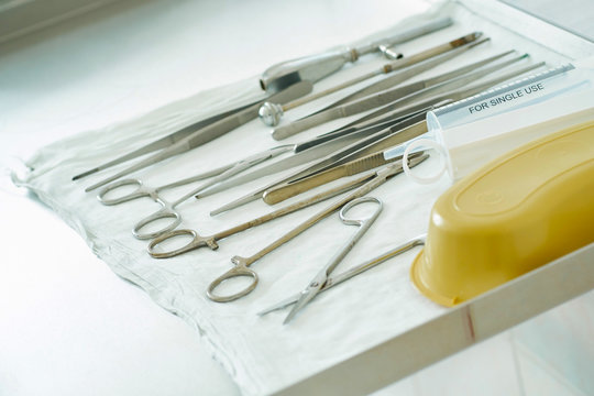Medical instruments for surgery are on metal table in the operating room close-up.