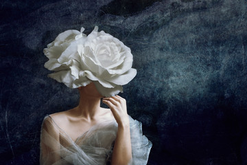 Strange fine art concept. The body of a woman, her head is a rose.