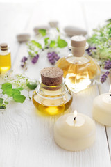Obraz na płótnie Canvas SPA still life with essential oil bottle, aromatherapy candles nad lavender flowers