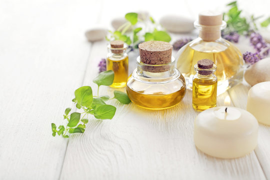 SPA still life with essential oil bottle, aromatherapy candles nad lavender flowers