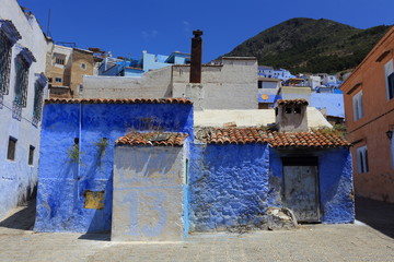 Blue street walls of the popular city of Morocco, Chefchaouen. Traditional moroccan architectural details. - 277672030