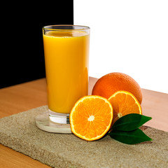 glass with orange juice decorated fruits on stone isolated on white background, concept of healthy food