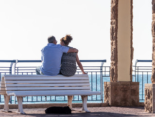 Couple in love sitting on a bench