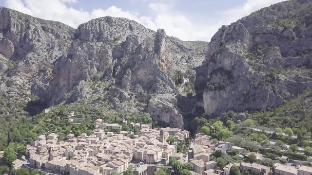 Aerial view over Moustiers dolly in towards Notre Dame Ravine and church.