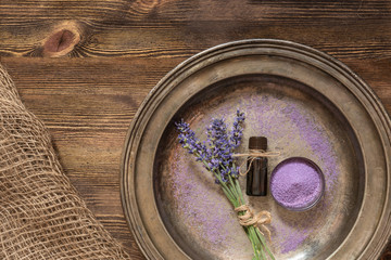 Lavender, bath salt and lavender oil on an old metal plate.