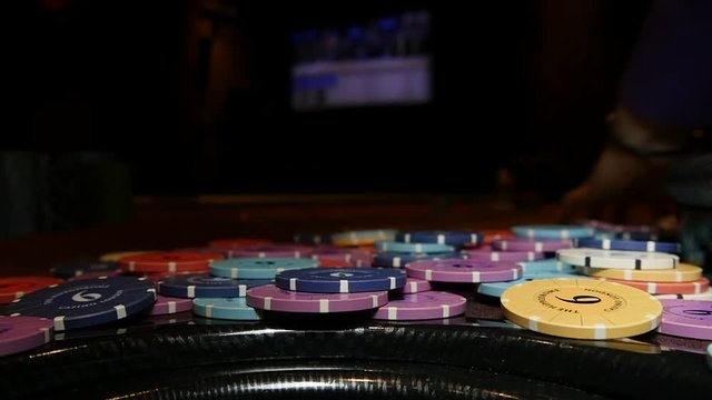 Casino chips are swept away after a loss