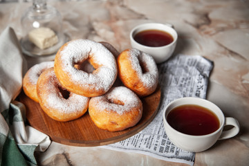 Donuts sprinkled with powdered sugar