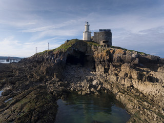 Fototapeta na wymiar Bob's Cave is found at the tip of Mumbles Head under the lighthouse, it's named after a member of the Mumbles Lifeboat crew, Bob Jenkins, who sheltered here two days after a tragic rescue attempt