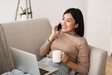 Girl Sitting with Cup of Morning Coffee And Laptop