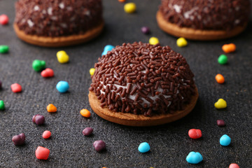 Chocolate Crinkle cookies. close-up of Crinkle cookies chocolate biscuits on Christmas cookies on a black plate, view from above.