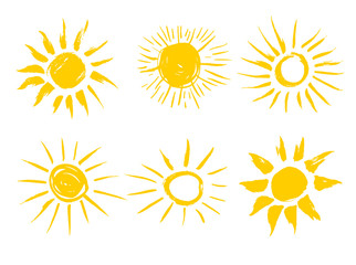 Set of painted yellow suns. Solar symbols design element. Vector illustration. Isolated on white background.
