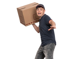 Portrait of cheerful Delivery man in cap holding big cardboard box. Crazy Handsome man looking on...
