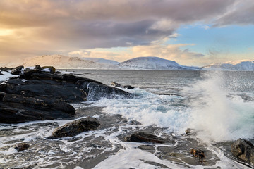 waves crashing on rocks, winter storm in norway, lyngen - 277683420