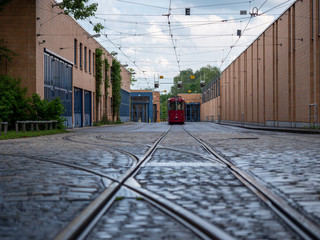 Image of red tram in urban environment