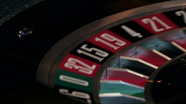 A ball spins on a roulette table