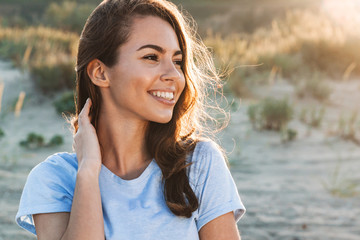 Beautiful young woman having a lovely time at the beach