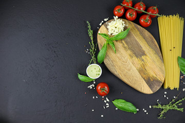Mockup cutting board. Italian composition with tomato, pasta and basil