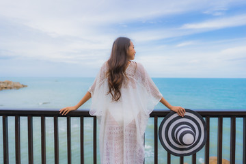 Portrait beautiful young asian woman looking sea beach ocean for relax in holiday vacation travel