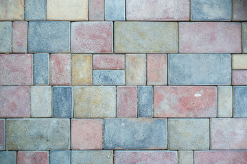 Stone pavement texture. Granite cobblestoned pavement background. Abstract background of old cobblestone pavement close-up. Seamless texture. Perfect tiled on all sides