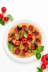 Pizza with salami and olives, top down view