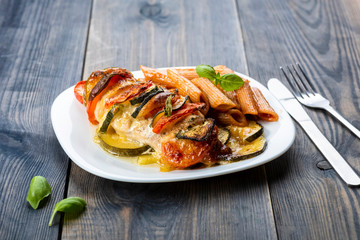 baked chicken breast with mozzarella and vegetables
