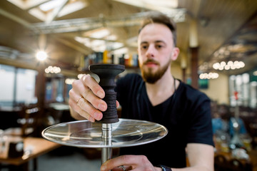 Hookah Server Waiter Prepares A Shisha Pipe For Smoking
