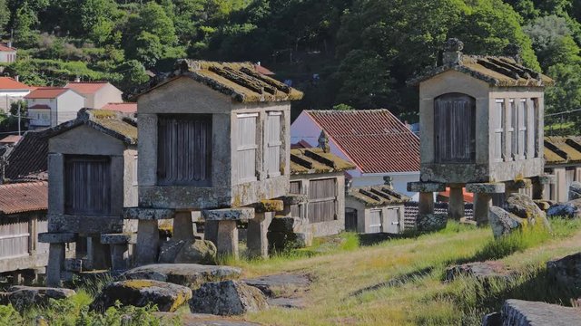 Espigueiros crowned on stone hill in Soajo settlement, Peneda-Geres