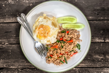 stir fried miced pork basil with sunny egg on rice