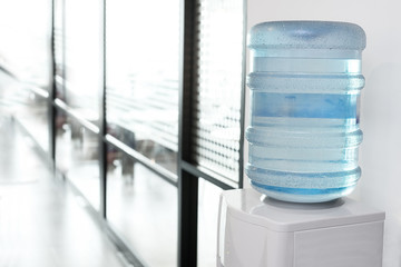 blue water gallon on electric water cooler