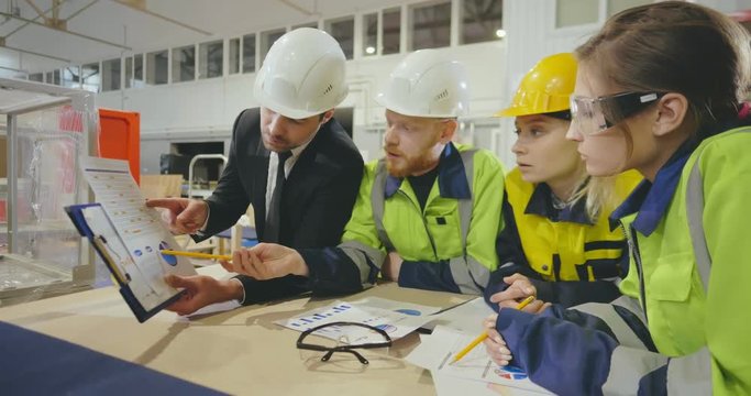 Industrial manager explaining new production technology