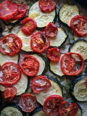 casserole with vegetables. zucchini, tomatoes, eggs, meat. in the pan.