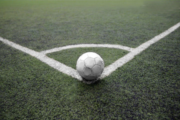 Soccer ball on the football border corner kick position