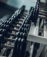 Fototapeta na wymiar close up. Rows of dumbbells in the gym .