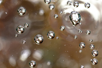 Bubbles of air on the surface of water as an abstract background