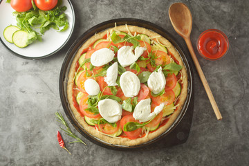 Vegetarian pizza. Cooking process of vegetable homemade pizza with fresh ingredients isolated on dark background. Copy space. Step by step photos.