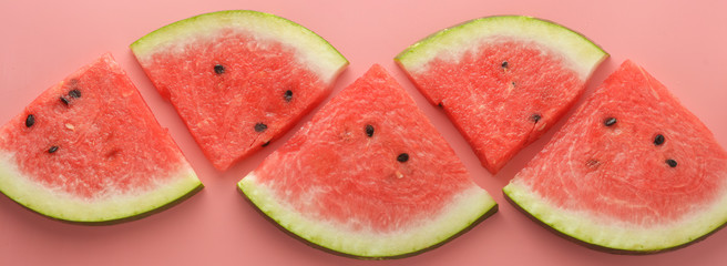 Watermelon slices on pink background. Summer foods. Banner.