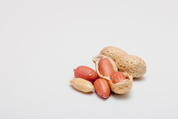 Large peeled peanuts close-up of beans in the shell. Unpeeled peanuts in the shell. Peanuts, for background or texture. Growing organic protein