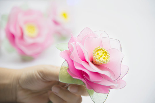Woman making beautiful nylon flower - people with DIY handmade flower concept
