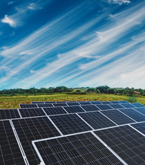 Solar energy power plant over a beautiful cloudy sky