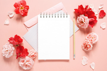 Natural template with blank notepad and various vintage roses