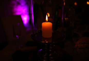 Romantic candle light in the dark.