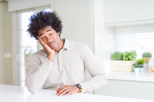 African American man at home thinking looking tired and bored with depression problems with crossed arms.