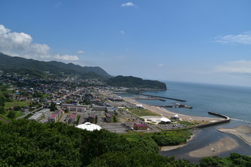 Fototapeta na wymiar Landscape with mountain and town in Hokkaido, Japan