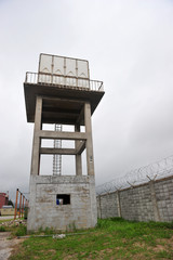Water tank tower and barbed-wire fence