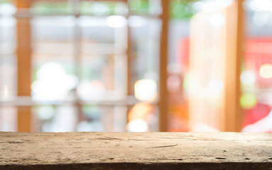 Empty of wood table top on blur of curtain with window view green from tree garden background.For montage product display or design key visual layout