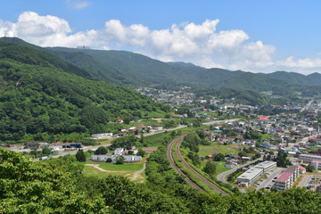 Fototapeta na wymiar Landscape with mountain and town in Hokkaido, Japan