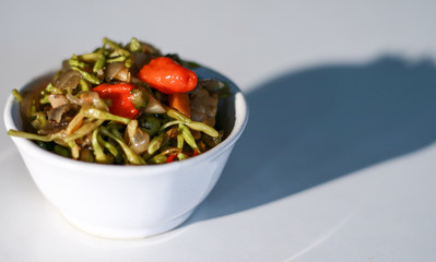 Sauteed papaya flowers on white background.