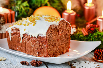 Christmas gingerbread cake among traditional decorations.