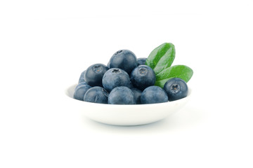 fresh blueberry on plate with leaf