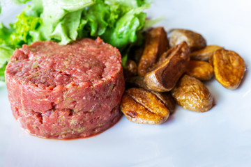 tasty Steak tartare (Raw beef) - classic steak tartare on white plate